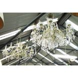 CHANDELIERS, a pair, twelve branch with glass drops on a white painted metal frame,