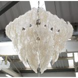 CHANDELIER, of square form with cascading tiers of amber flecked glass leaves,