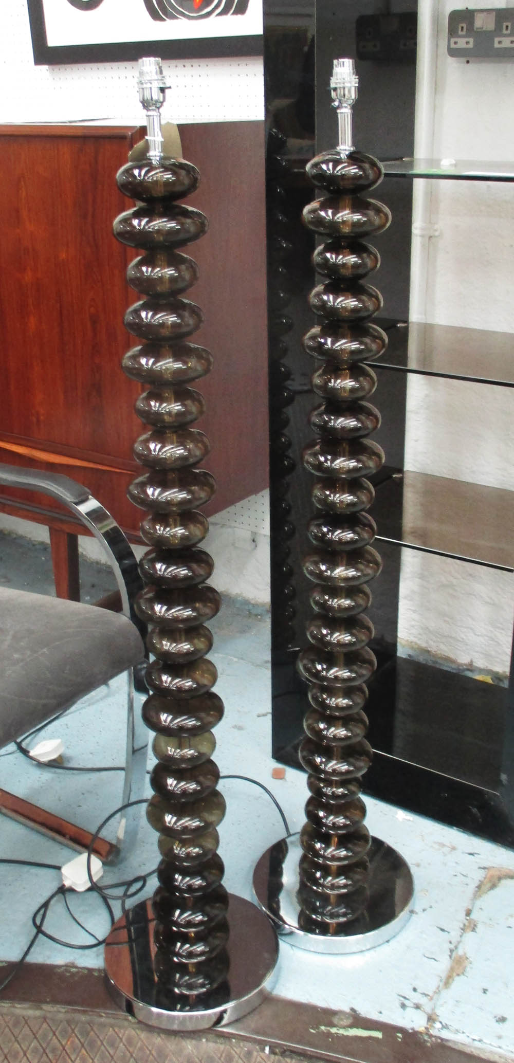 STANDARD LAMPS, a pair, glass ball columns on polished metal circular bases, 124cm H.
