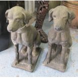 DOG STATUES, a pair, 19th century Cotswold stone style weathered finish, 75cm H x 58cm L.