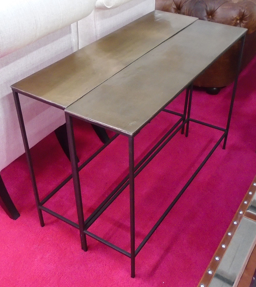 CONSOLE TABLES, a pair, in a bronzed metal finish, 99cm x 25cm x 71cm H.