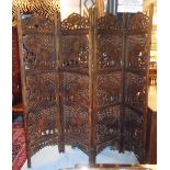 CARVED SCREEN, four fold Indian hardwood depicting elephants, each panel 50cm W x 183cm H.