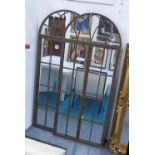 GATED MIRRORS, a pair, with domed top in a distressed frame, 180cm x 75cm.