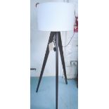 STANDARD LAMP, triform base with white shade, 156cm H.