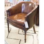 LIBRARY ARMCHAIR, George III design mahogany with studded tan brown leather and cushions.