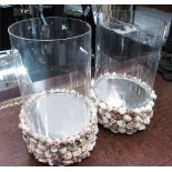 STORM LANTERNS, a pair, circular glass with shell encrusted base, each 19cm W x 29cm H.