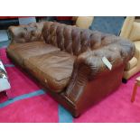 CHESTERFIELD SOFA, in brown buttoned leather, by Tetrad, 221cm W x 105cm D x 72cm H.