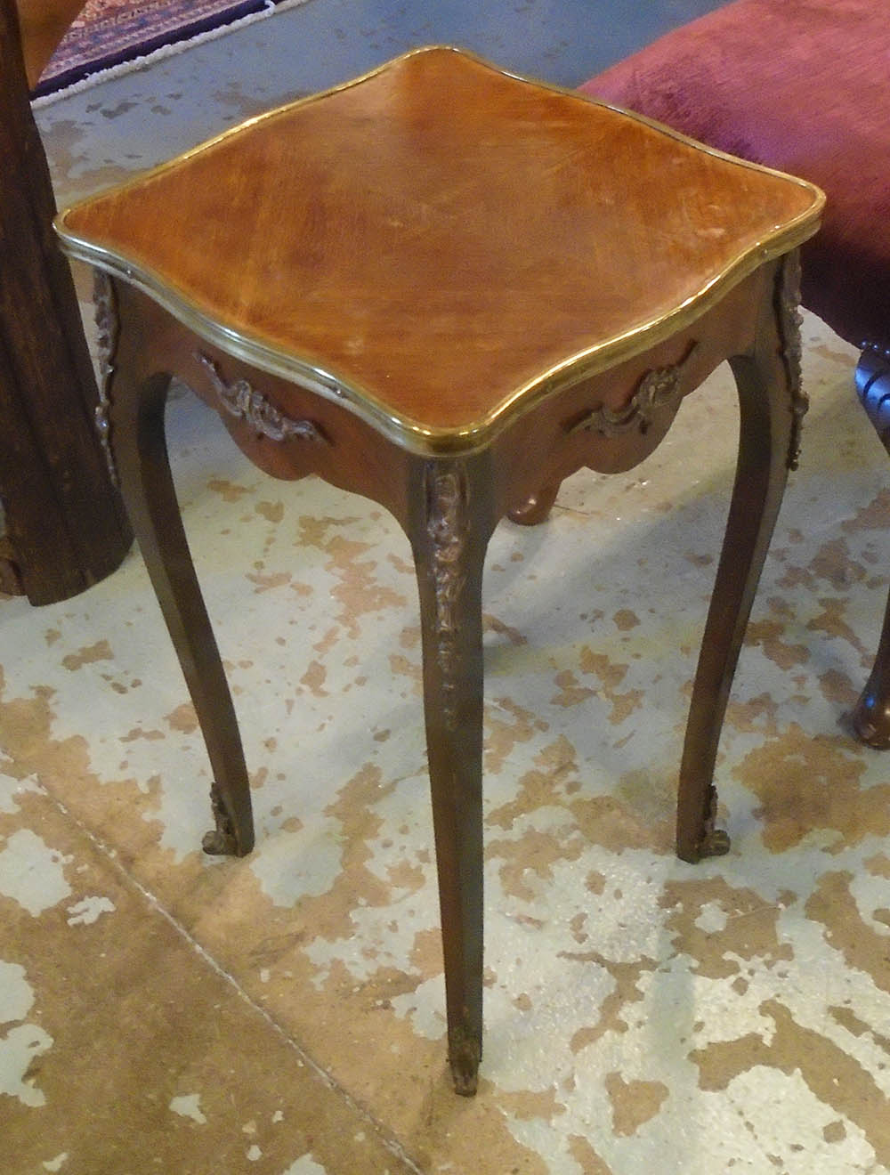 OCCASIONAL TABLE, early 20th century French rosewood with a shaped top,