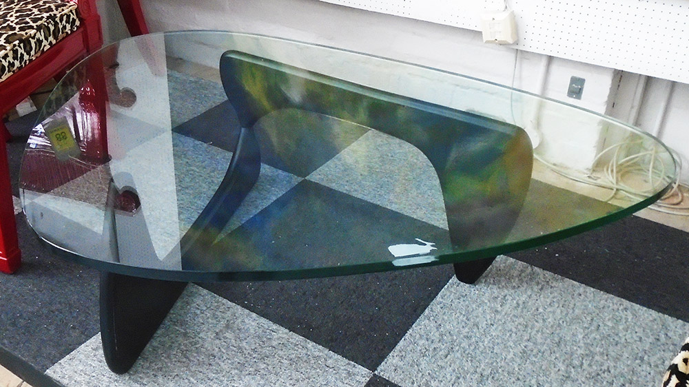 LOW TABLE, with a glass shaped top, 42cm H x 104cm x 121cm.