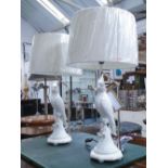 TABLE LAMPS, a pair, parrot form in cream glaze with shades, 76cm H.