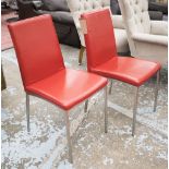 BO CONCEPT DINING CHAIRS, a set of eight, with red leather upholstered backs and seats,