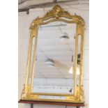 OVERMANTEL, French giltwood and gesso, circa 1880, with arched bevelled plate,