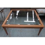 LOW TABLE, carved wooden frame with glass top, 110cm W x 110cm D x 44cm H.