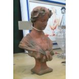 FEMALE STONE GARDEN BUST, French 19th century terracotta style in a weathered finish,