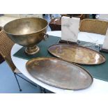 SERVING TRAYS, a pair, oval in bronze, 68cm x 33cm, champagne bath with handles 47cm diam.