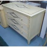 COMMODE, three drawer, cream, Regency style with decorative detail, 110cm W x 50cm D x 85cm H.