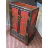 CHINESE CABINET, red and black lacquered decorated with bats,