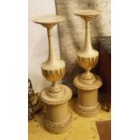 PEDESTALS, a pair, cream painted and parcel gilt of leaf decorated urn form, 113cm H x 32cm D.