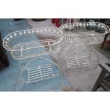 FLOWER BASKETS, a pair, white painted in iron, on stands, 65cm x 34cm x 76cm H.