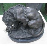 LION WITH SNAKE, on marble base, 39cm L.