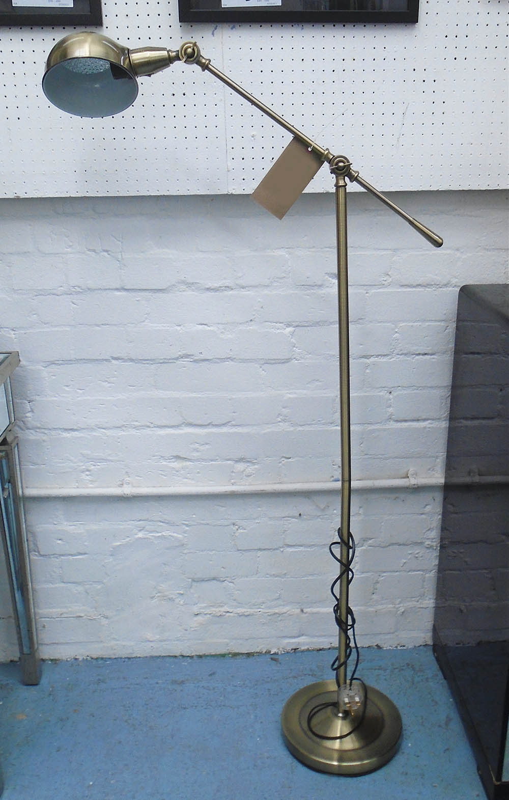 FLOOR READING LAMP, adjustable, in a bronze finish.