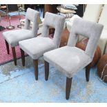 DINING CHAIRS, a set of three, grey chenille, each 49cm W x 86cm H.