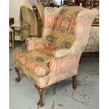 WING ARMCHAIR, Georgian style, with faded floral patterned fabric and cushion seat, 79cm W.