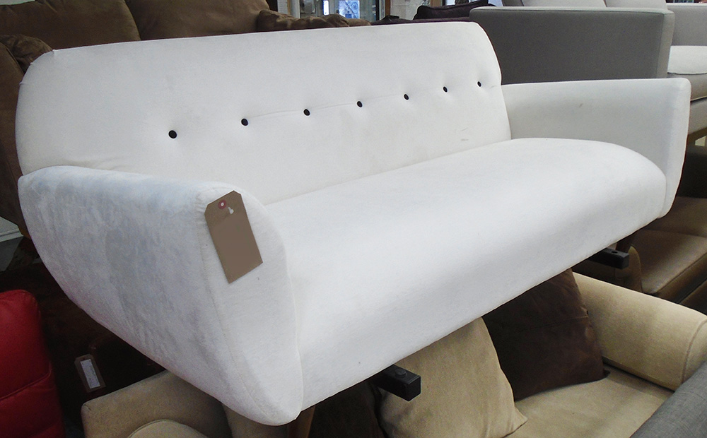 SOFA, two seater, button back in cream on turned supports, 187cm L.