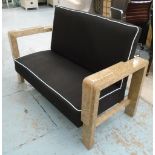 SOFA, two seater, Art Deco style in black fabric with white piping on an ornately lacquered frame,
