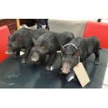 BOARS, a set of three, realistically cast in resin coloured finish, 43cm L.