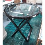 SIDE TABLES, a pair, circular with glass tops on ebonised square supports, 75cm diam. x 78cm H.