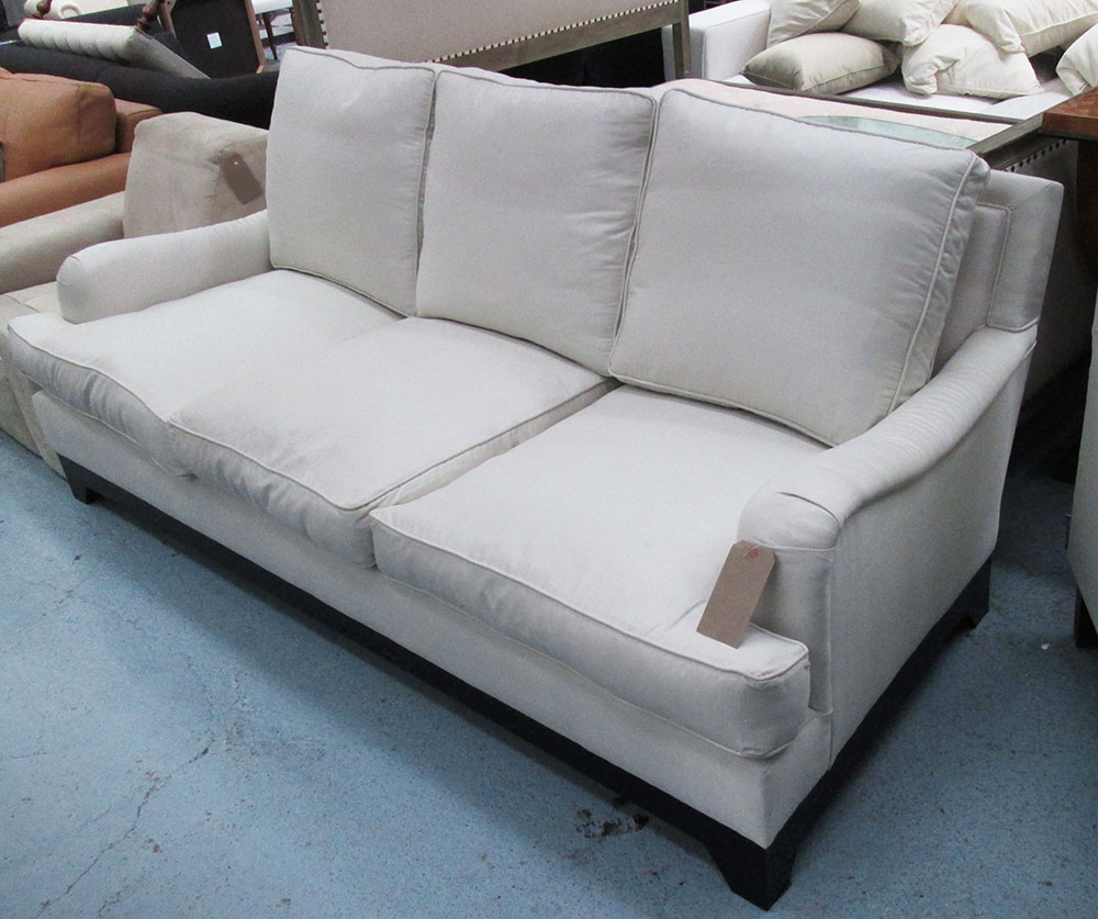 SOFA, three seater, Howard style in cream fabric on square supports, 217cm L.