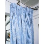 CURTAINS, a pair, in blue patterned De La Couna fabric, lined and interlined, each curtain approx.