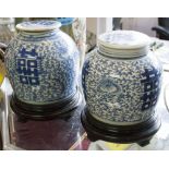 VASES, a pair, Chinese Kanxi style blue and white ceramic with covers on ebonised stands,