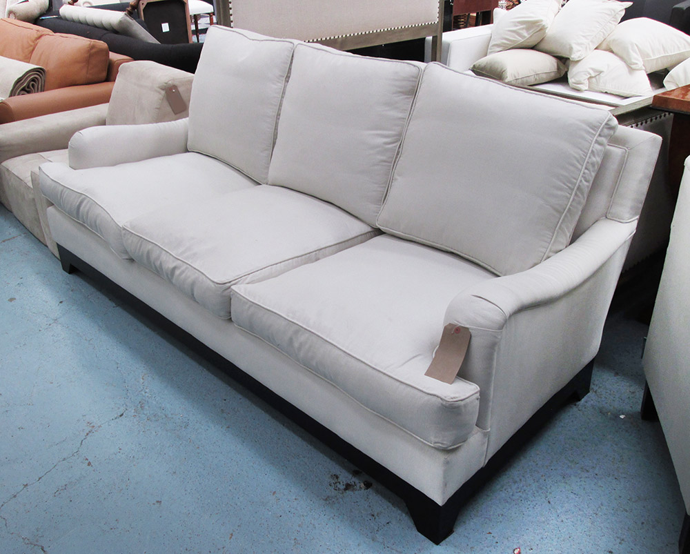 SOFA, three seater, Howard style in cream fabric on square supports, 217cm L.
