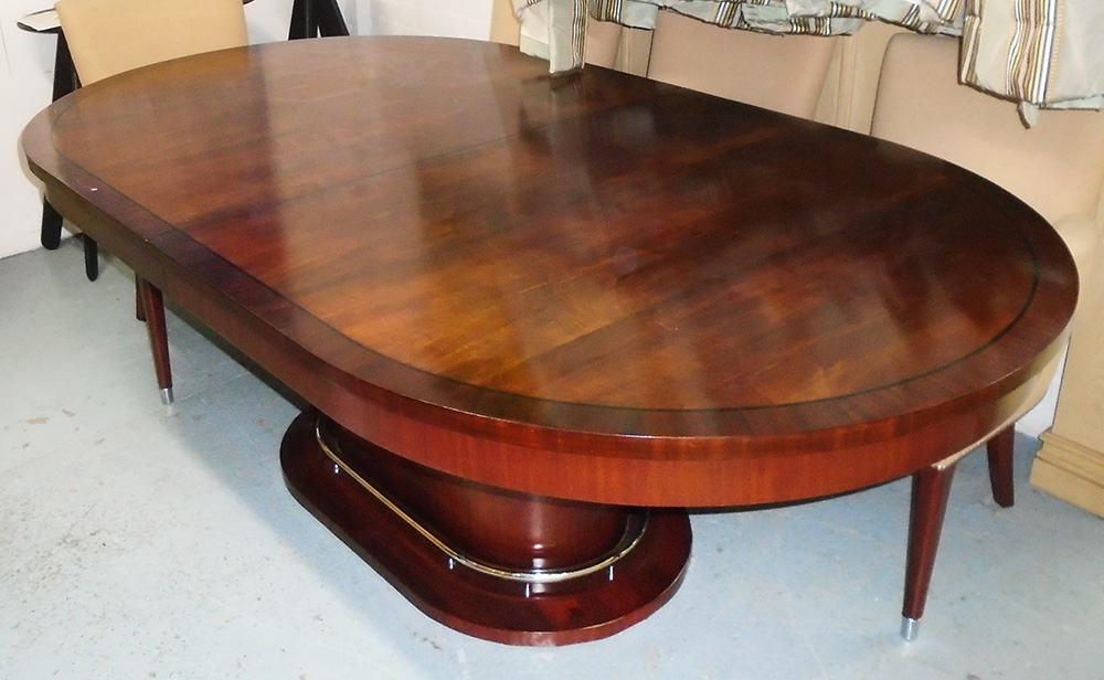 RALPH LAUREN OVAL DINING TABLE, extending with one leaf on oval base with metal rail,