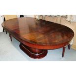 RALPH LAUREN OVAL DINING TABLE, extending with one leaf on oval base with metal rail,