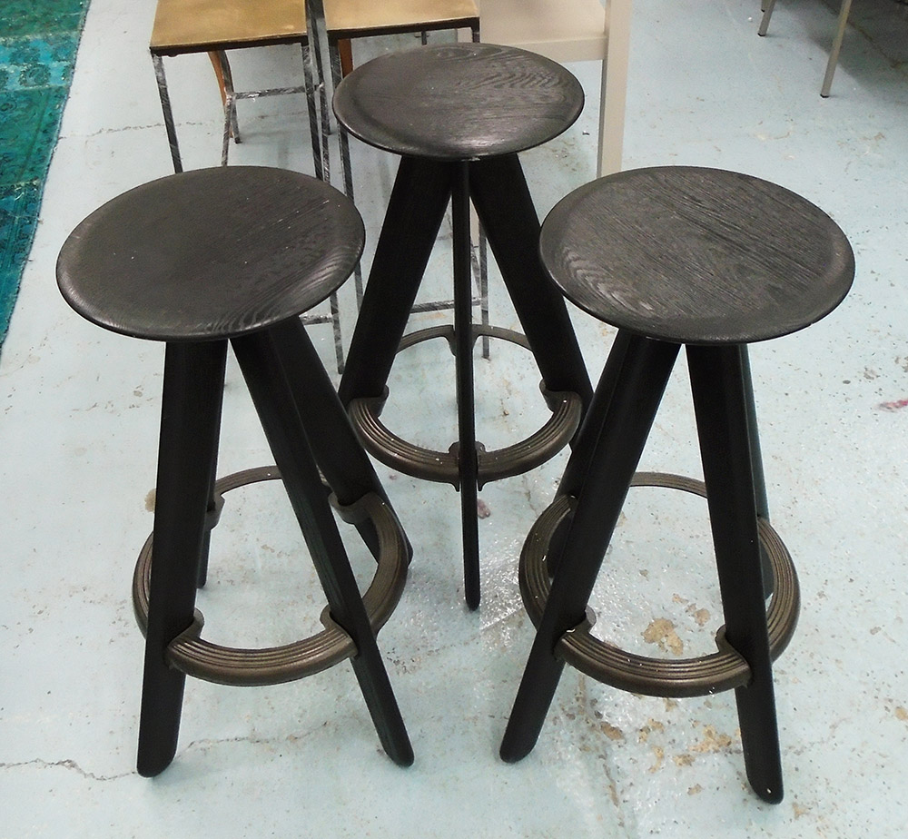 BAR STOOLS, a set of three, by Tom Dixon, cost £360 each new, each 35cm W x 78cm H.