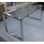 DINING TABLE, with a rectangular glass top on chrome end supports, 160cm L x 75cm H x 81cm D.