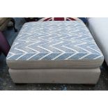 OTTOMAN/FOOTSTOOL, with a geometrically patterned top cushion, 110cm W x 100cm D x 50cm H.