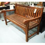 GARDEN BENCH, in slatted teak on square supports, 150cm L.