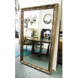 MIRROR with bevelled plate in an ornate silver painted frame, 171cm x 109cm.