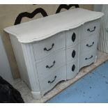 COMMODE CHEST, white, of shaped form with three drawers, 57cm D x 86cm H x 128cm W.