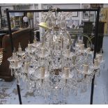 CHANDELIER, with glass droplets and two tiers of branches, twenty four sconces in all, approx.