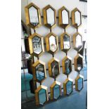 MIRROR, lozenge style with sixteen mirrors on a gilded and ebonised frame, 168cm x 103cm.