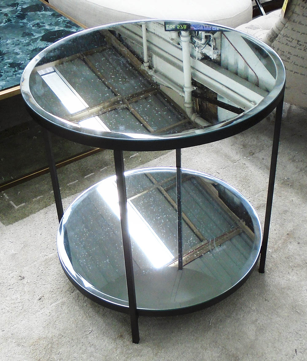 STOCK BRONSON SIDE TABLE, by Robert Langford with bevelled mirrored top and undershelf, 61cm diam.