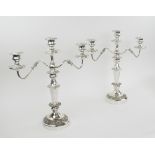 CANDELABRA, a pair, 20th century silver plate each with three lighting arms, foliate cast detail,