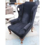 WINGBACK ARMCHAIR, in raised blue square fabric on cabriole supports, 80cm W.