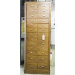 BANK OF DRAWERS, early 20th century oak with two rows of thirteen drawers flanked by locking stiles,