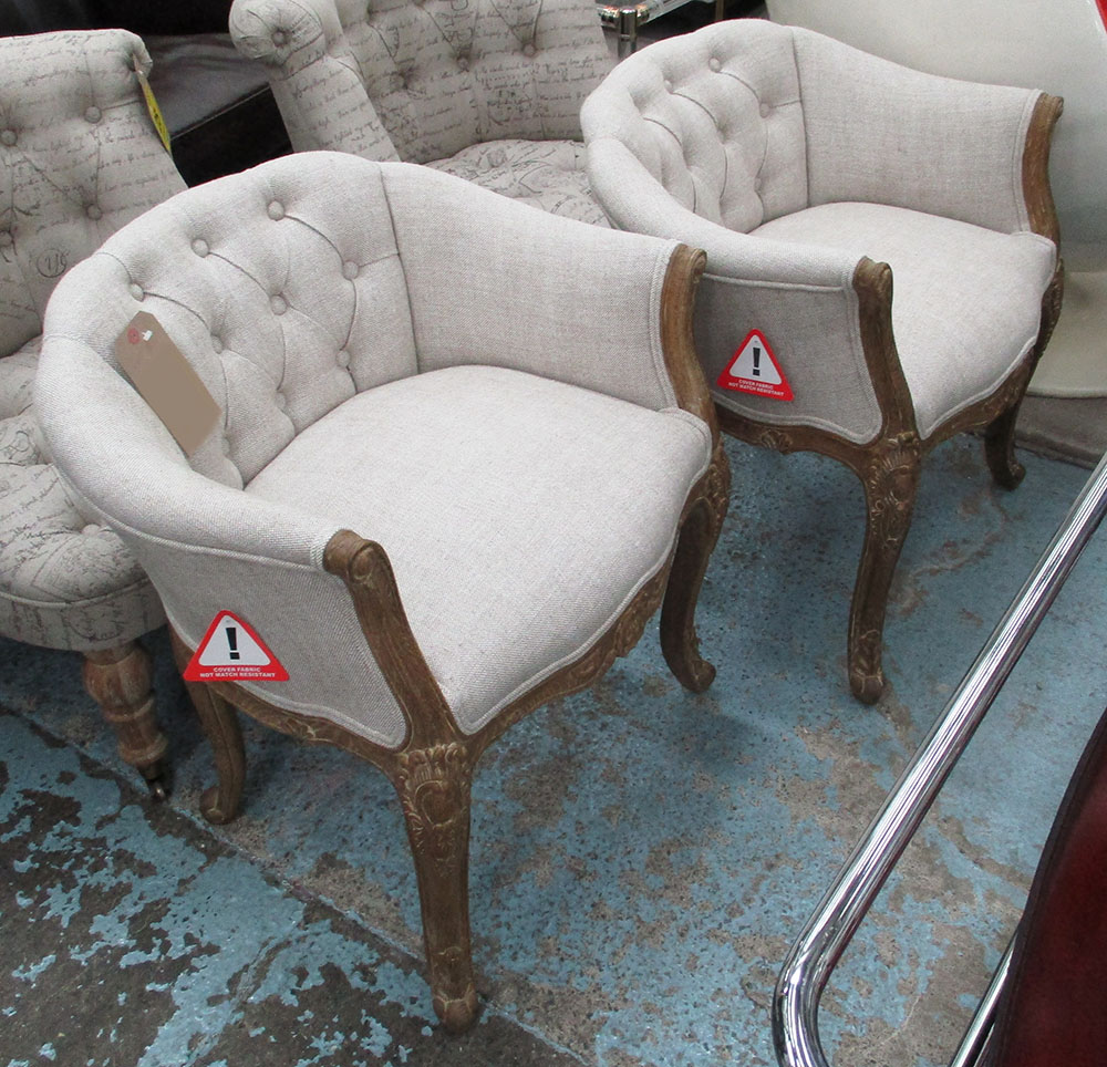 BEDROOM CHAIRS, a pair, French style in neutral fabric, buttoned back in carved wooden frame,